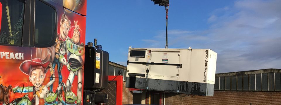 crane lorry lifting generator.